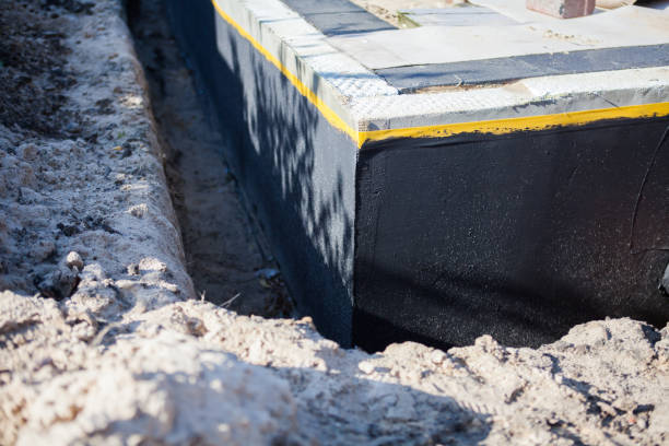 Professional Interior Drainage System technician working in Absecon, NJ